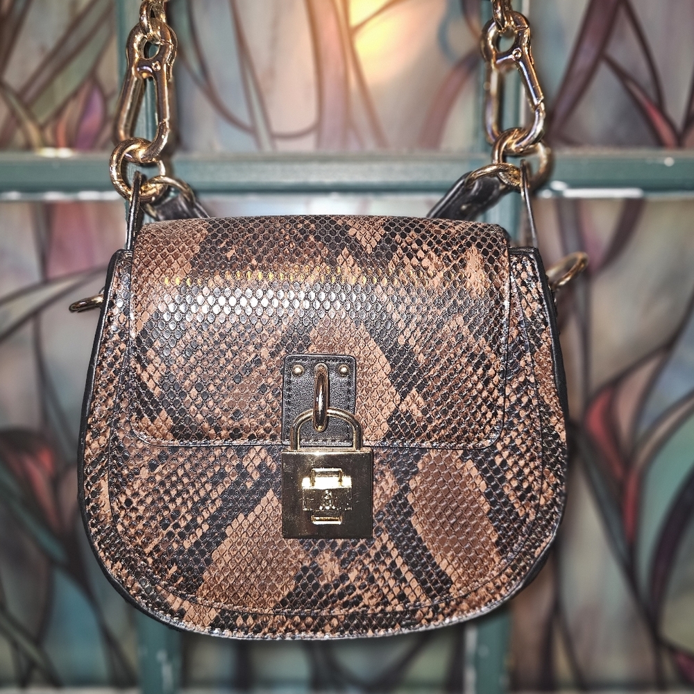 Steve Madden Crossbody snake print purse in Brown with front lock closure
